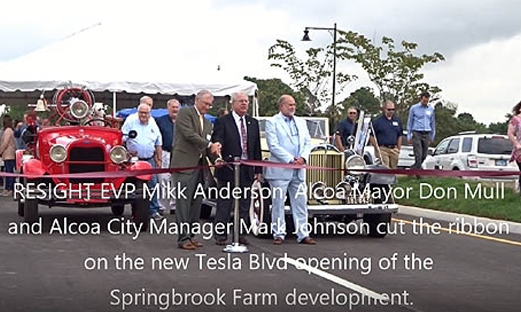 RESIGHT EVP Mikk Anderson, Alcoa Mayor Don Mull and Alcoa City Manager Mark Johnson cut the ribbon on the new Tesla Blvd opening of the Springbrook Farm Development